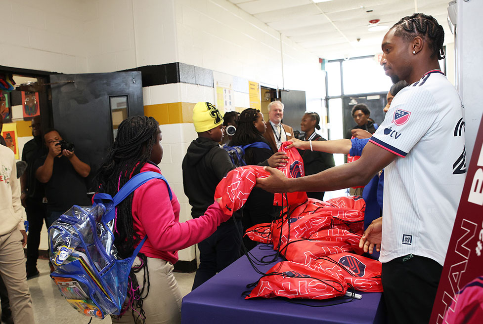 Jonathan Bell hands out care packages at a St. Louis event