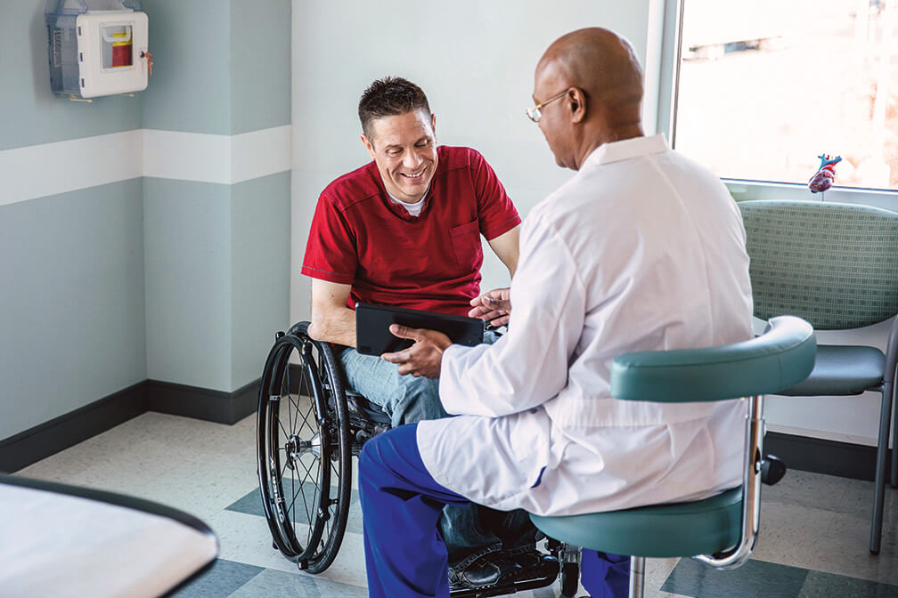 patient and physician have discussion in hospital.