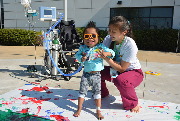 Child with therapist during art therapy