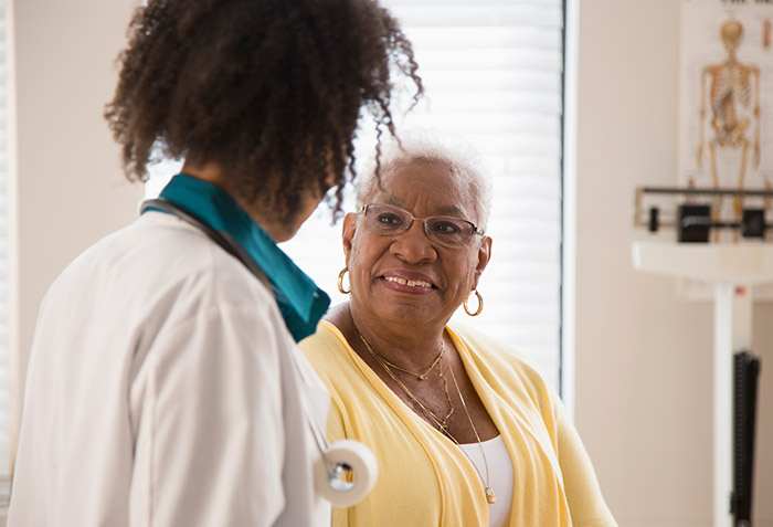 African American patient with doctor during medical consultation