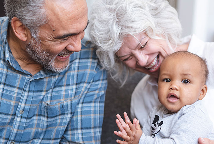 happy grandparents with grandchild