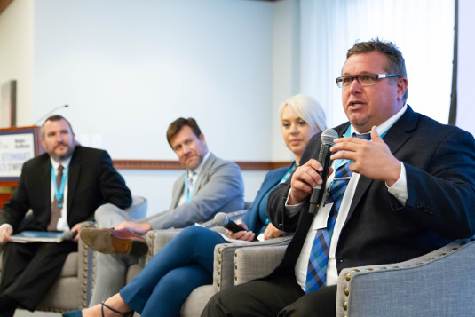 Four panelists at a healthcare event