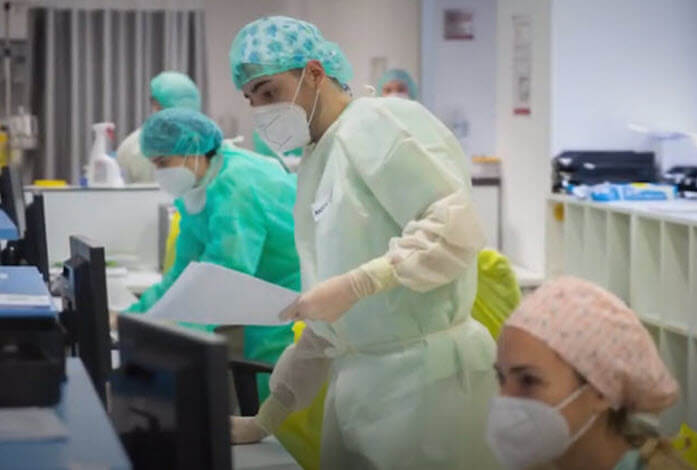 doctors and nurses care for patients in hospital
