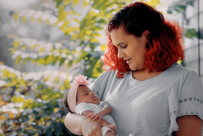 A mother holding a newborn baby