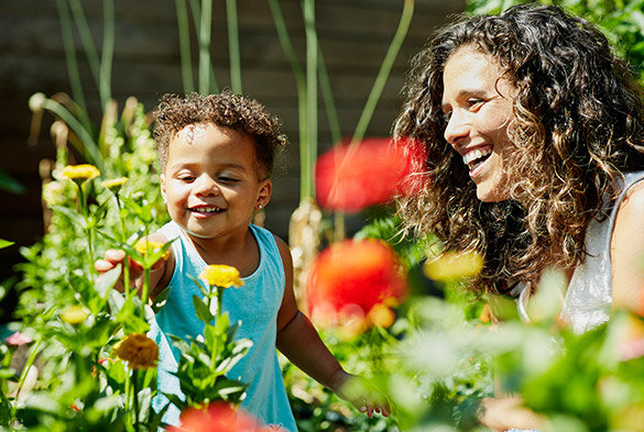 Mom with toddler in a community garden