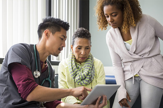 doctor discussing patient information with patient family