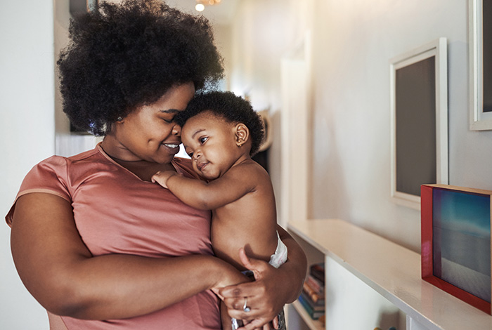 A mother holding a newborn baby