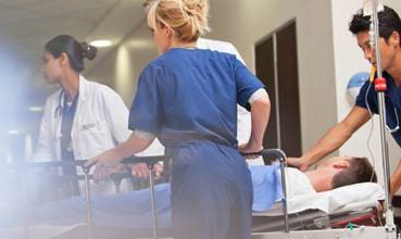 medical staff rushing a patient in ICU