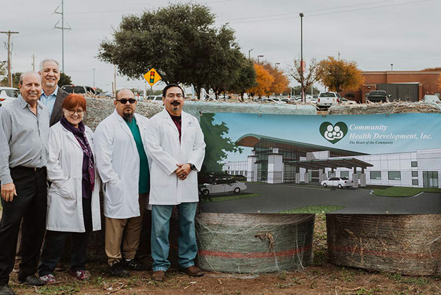 Doctors in front of proposed Uvalde community center rendering.